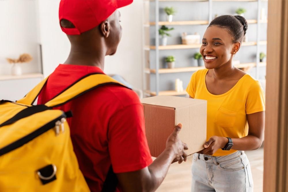 Photo of a delivery man making a delivery.